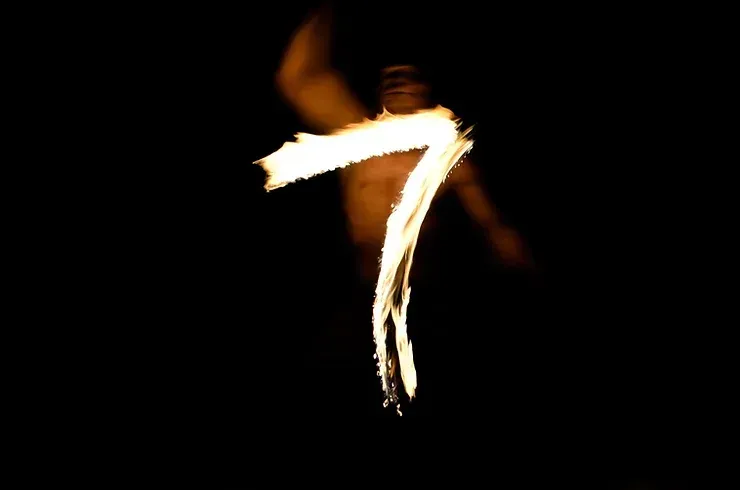The number 7 illuminated in the dark